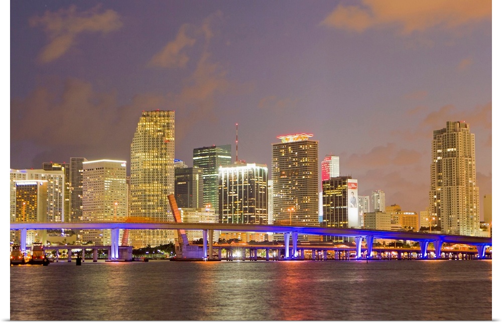 The Miami causeway and skyline at night.