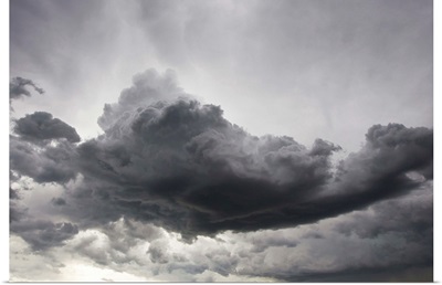 Underneath a supercell thunderstorm with dark and eerie storm clouds