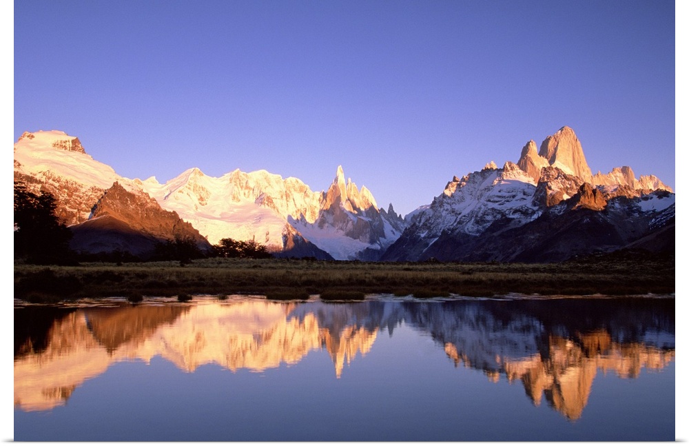 Cerro Torre, centre, and Mount FitzRoy, right, Cerro Solo, left, at dawn famous peaks on edge of Patagonian icecap, Los Gl...
