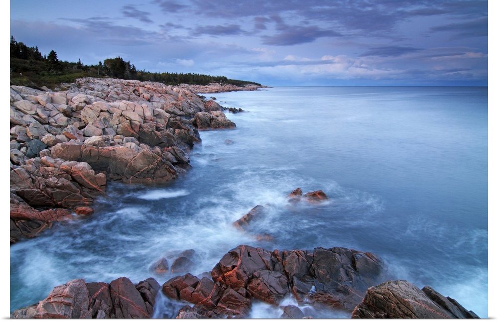 View of the Atlantic ocean from the rocky coast at the Cape Breton Highlands National Park in Nova Scotia, Canada.
