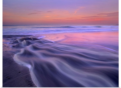 Fresh water stream flowing into the Pacific Ocean, Zuma Beach, Malibu, California