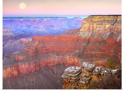 Full moon over the Grand Canyon at sunset as seen from Pima Point Arizona