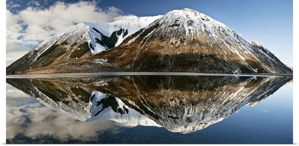 Mountains reflecting in Lake Pearson in winter, Castle Hill Basin, Canterbury, New Zealand