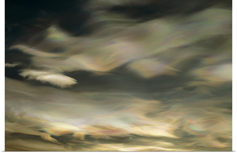 An abstract artwork piece of clouds in a winter sky. There is a pearl essence and wave like appearance to the clouds.