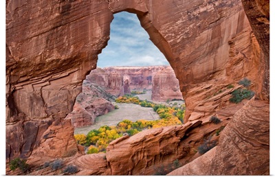 Natural arch with river valley in the background, Arizona