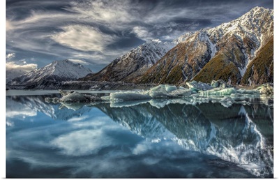Reflection of clouds, peaks and icebergs in lake, Tasman Glacier, New Zealand