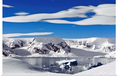 Snow-covered mountains along coast, Antarctica