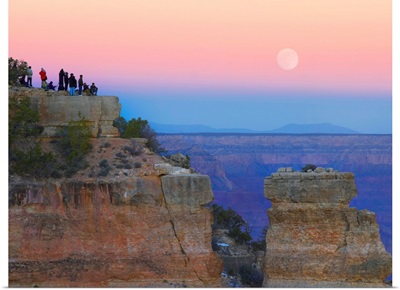 Tourists enjoying sunset and full moon at Yaki Point, Grand Canyon, Arizona
