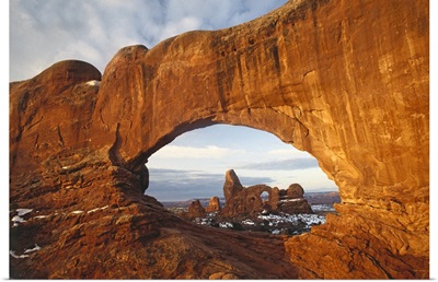 Turret arch through north window arch Arches National Park Utah