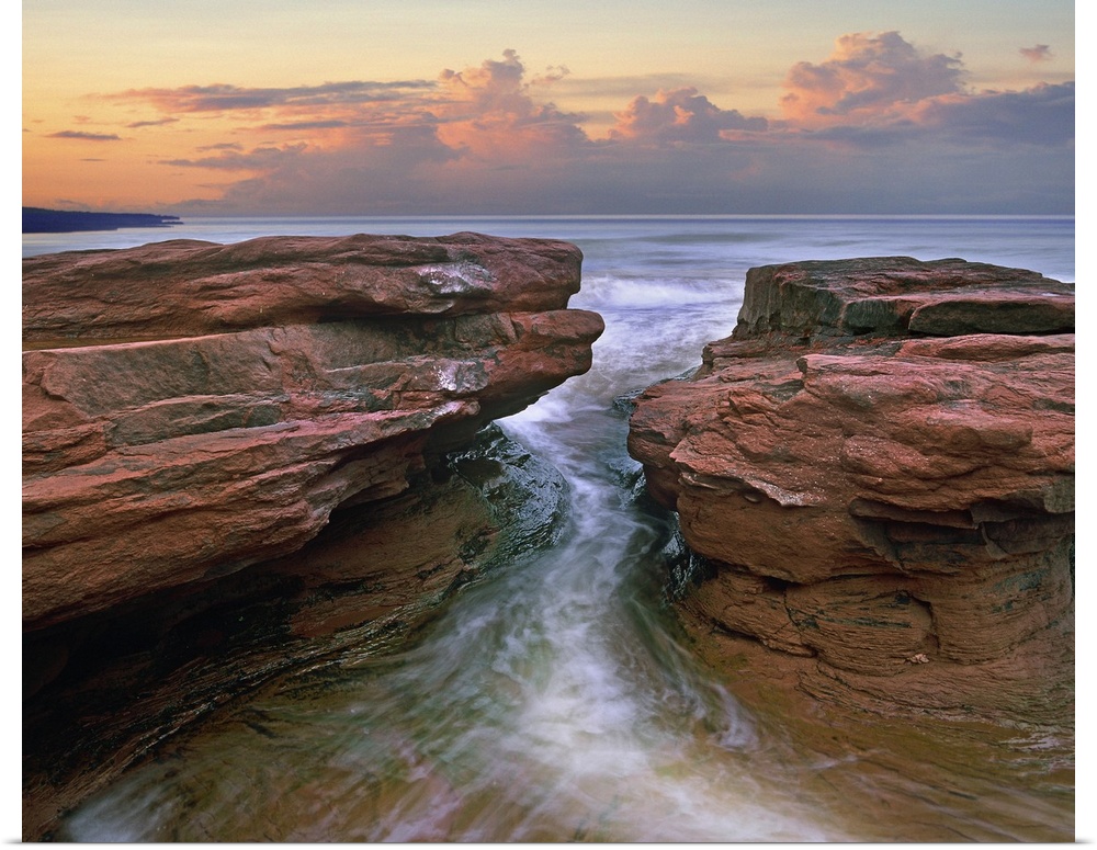 Water rushing through coastal rocks, Gulf of Saint Lawrence, Prince Edward Island National Park, Canada.