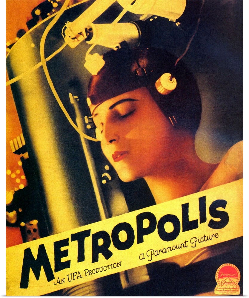 Big, vertical movie advertisement for the silent film Metropolis, from 1927.  An image of a woman with a robotic machine a...