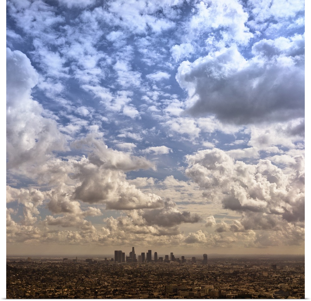 Aerial photograph of the downtown LA area under a blanket of clouds.