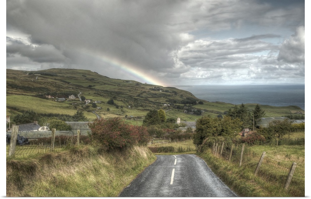 A photograph looking down the road of a countryside landscape in Northern Ireland.