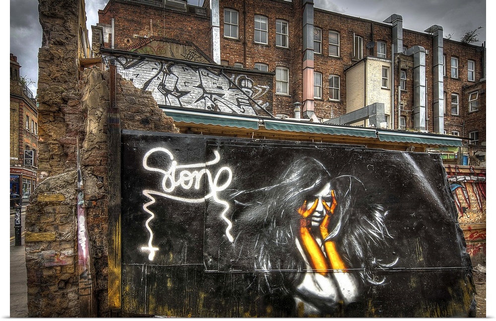 Fine art photograph of a graffiti on the facade of a city building.