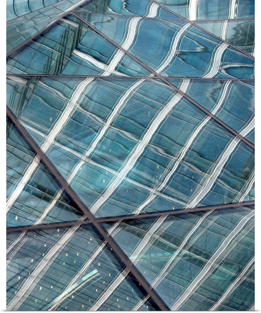 A close-up photograph of glass windows on a building.