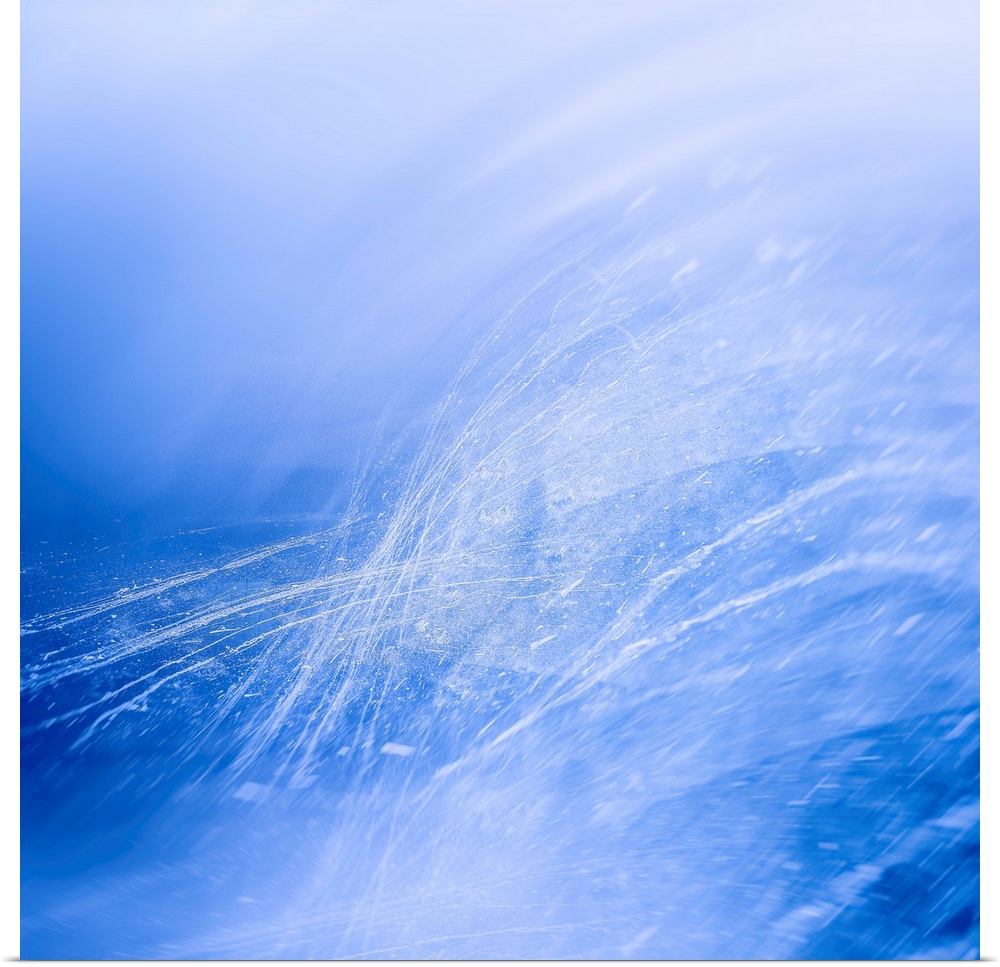 Abstract photograph in blue and white with thin lines and splatter creating movement.