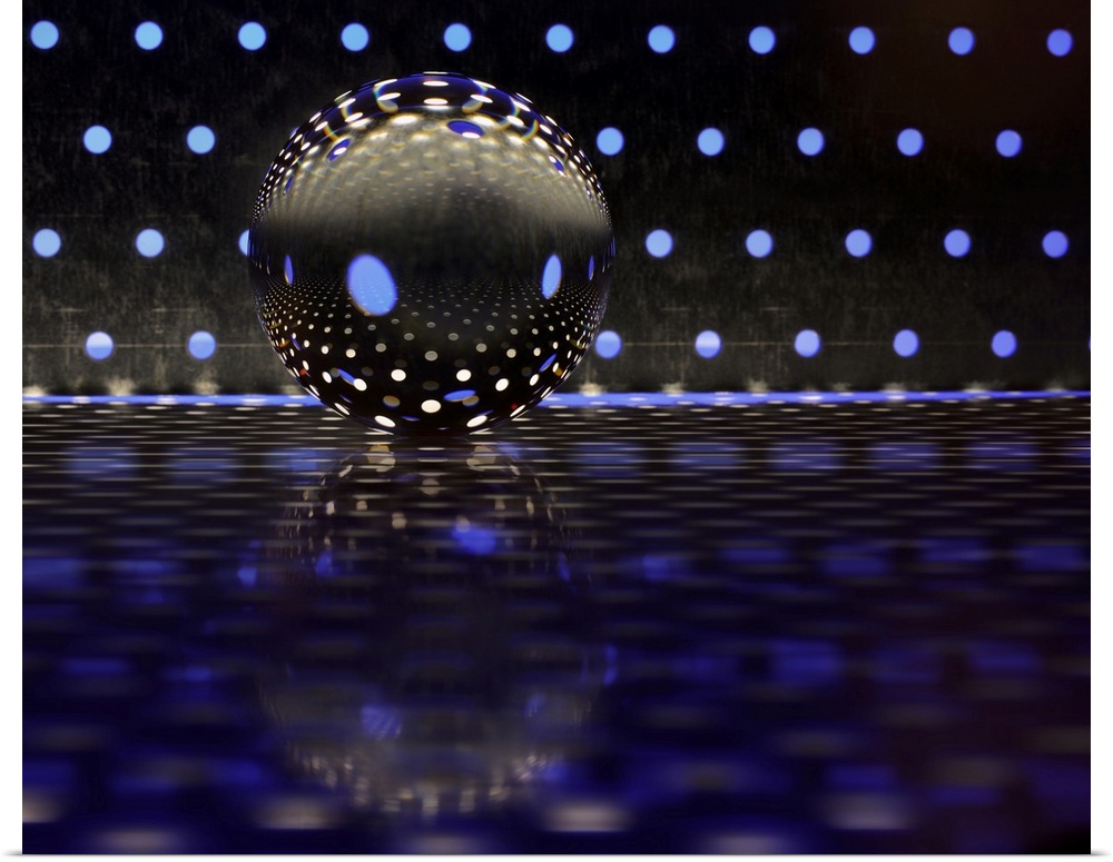 A glass ball on a metal plate with blue dots of color reflecting.
