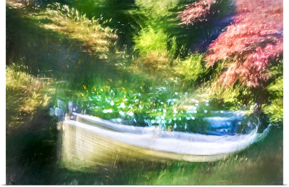 Old boat in a park, filled with flower.