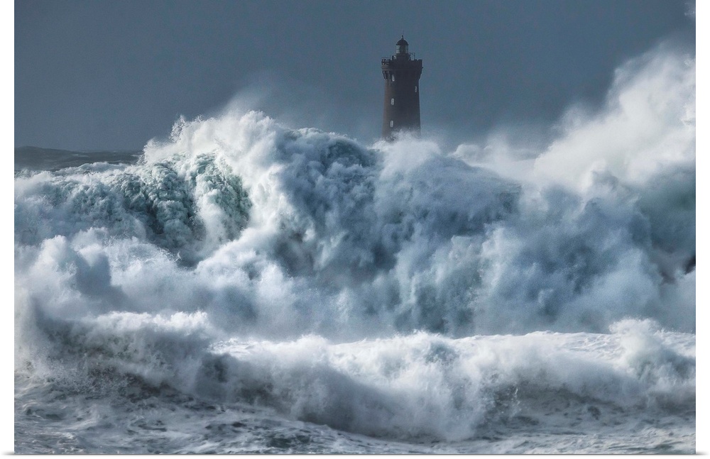 A photograph of a lighthouse in France being hit with crashing waves.