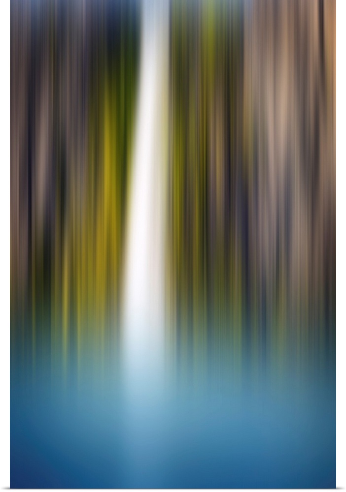Abstract photograph of a blurred waterfall with brown, green, blue, and white hues.