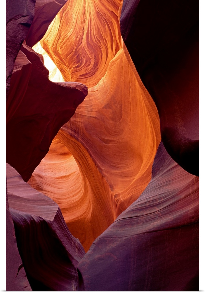 Large photograph taken from within a cave of Antelope Canyon that is located in Arizona.  The walls of the canyon are cove...