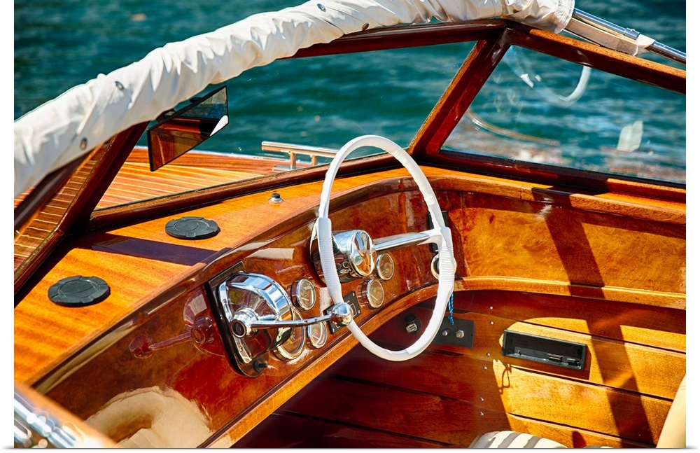 Fine art photo of the polished wood dashboard of a motorboat.
