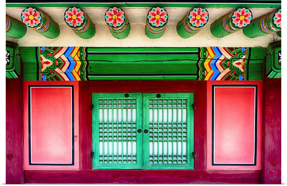 Intricately painted beams and window shutters on the Royal Palace in Seoul, South Korea