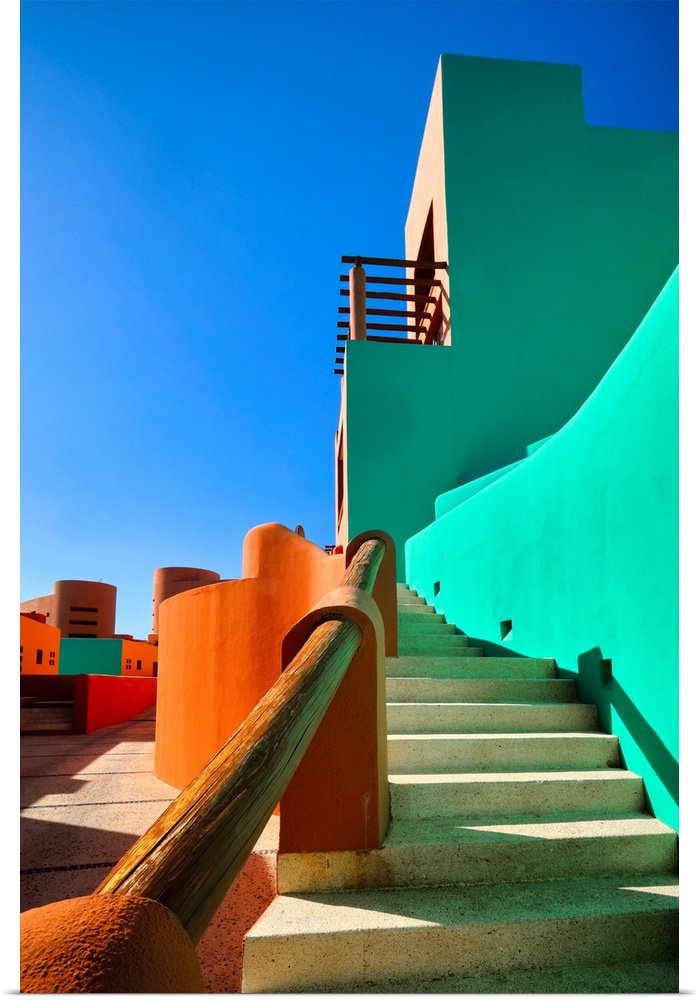 Low angle view of bold colored Mexican style architecture, Cabo San Lucas, Baja California Sur, Mexico.