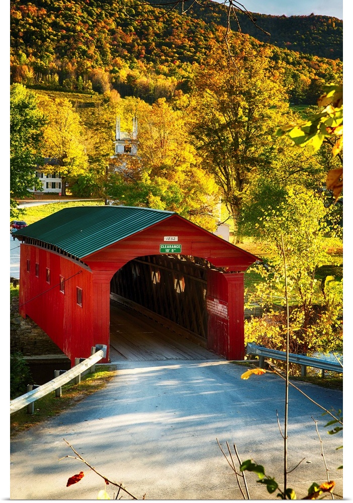 Fine art photo of a red covered bridge in Vermont in the fall.