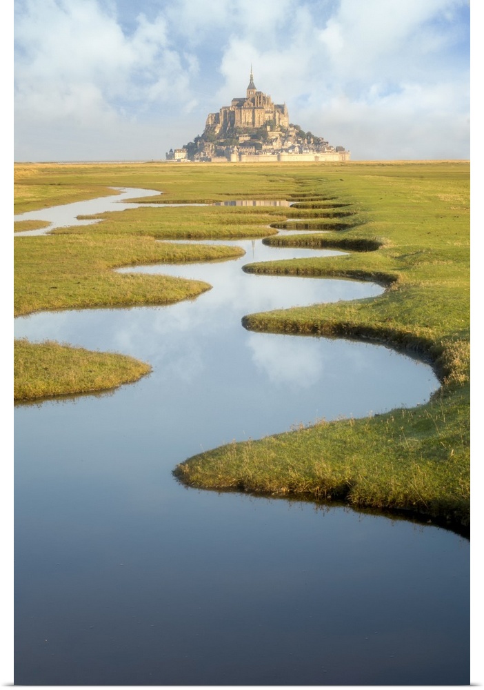 Around Mont Saint Michel in France. After high tides, some nices water draws on the green lands call polders. Vertical view.