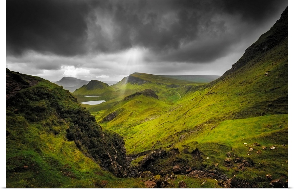 Fine art photo of a lush valley under a stormy sky.