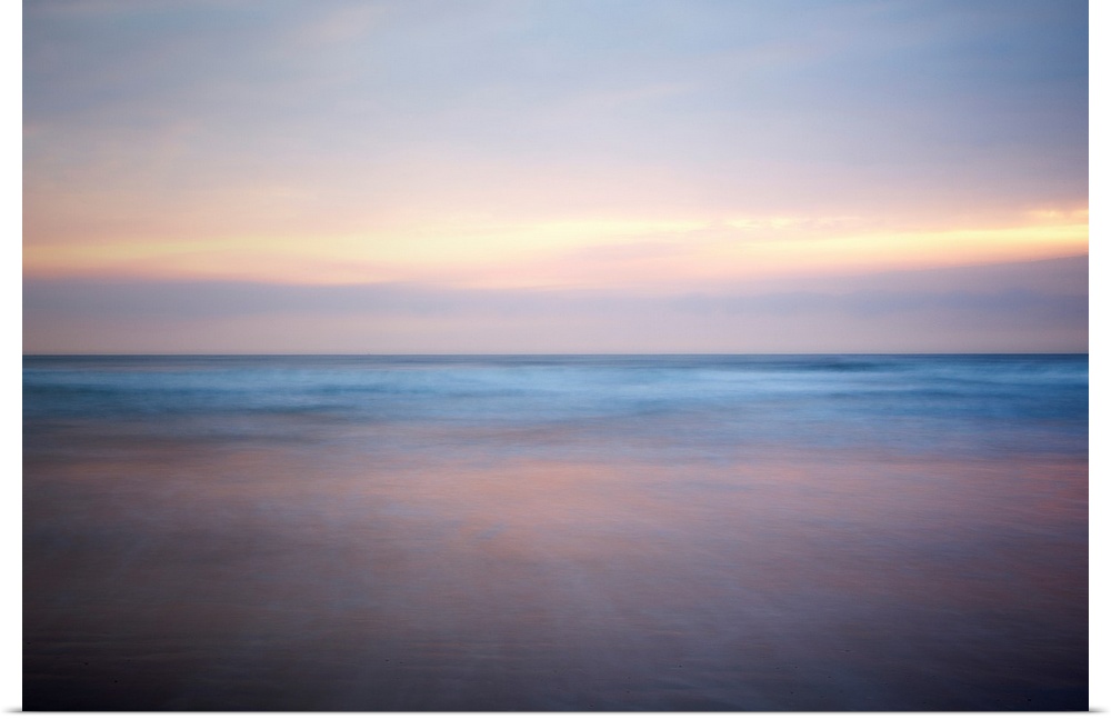 An abstract fine art photograph of a sunrise that has a soft and blurred appearance.