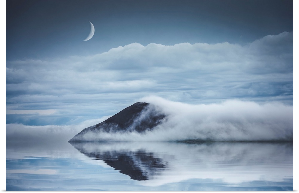 Reflection of a mountain in Iceland with a crescent moon