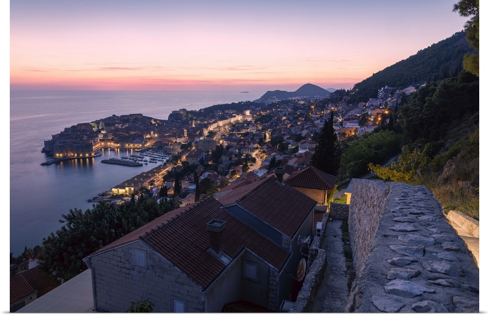 The old town and coastline of Dubrovnik, Croatia, during blue hour after sunset.