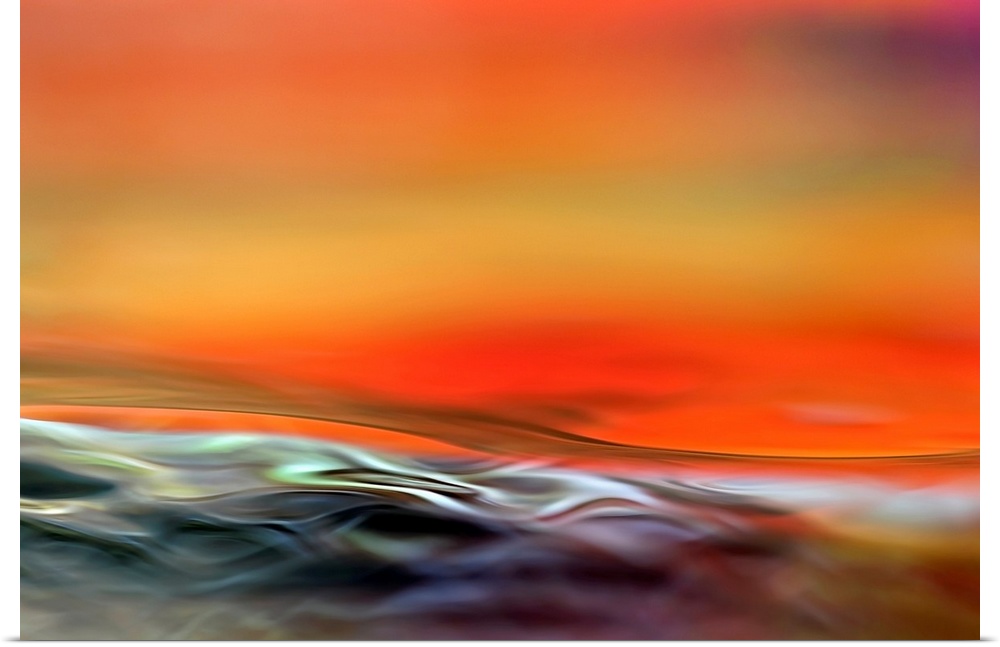 Big, horizontal fine art photograph of waving, multi-colored water at the bottom of the image.  Above is a soft background...