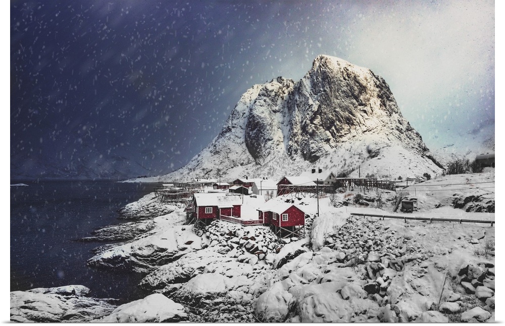Small Norwegian village with red cabins under the snow