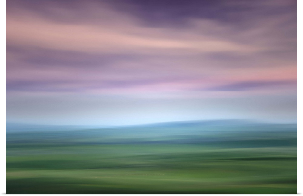 Long exposure image of the Palouse hills with a lavender sky.