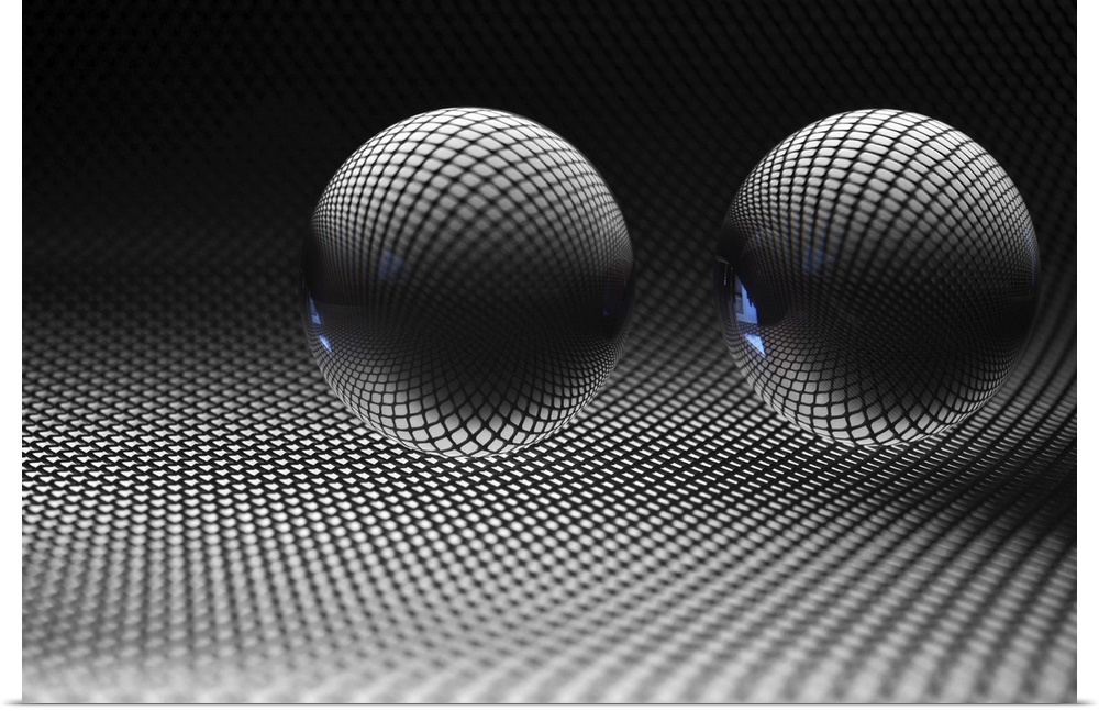 Two glass spheres reflecting a field of small dots.