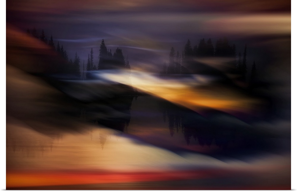 Abstract photograph with a black tree line silhouette reflecting into water and a dreamy yellow, orange, red, and purple o...