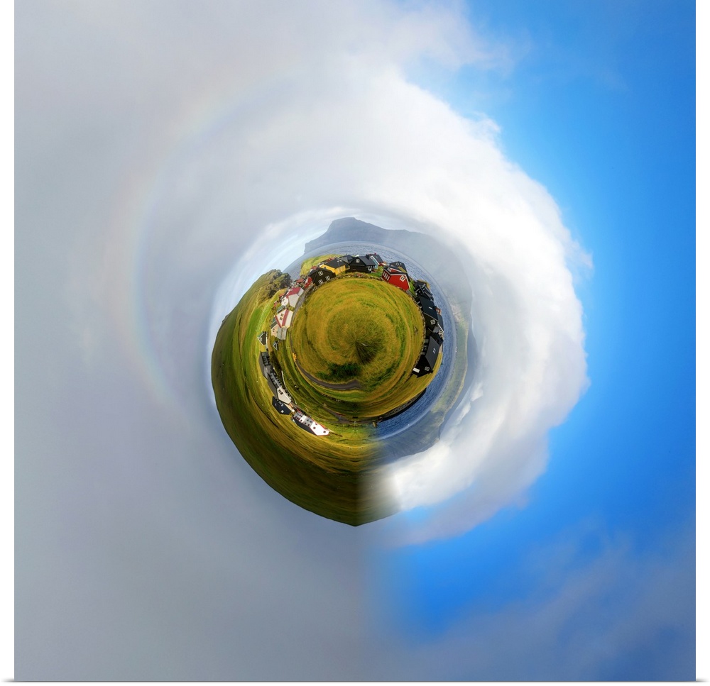 A red barn on green farmland, with a stereographic projection effect on the image, resembling a tiny planet.