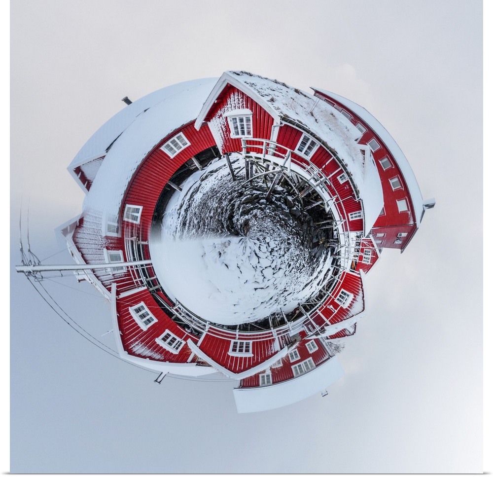 A large red barn after a recent snowfall, with a stereographic projection effect on the image, resembling a tiny planet.