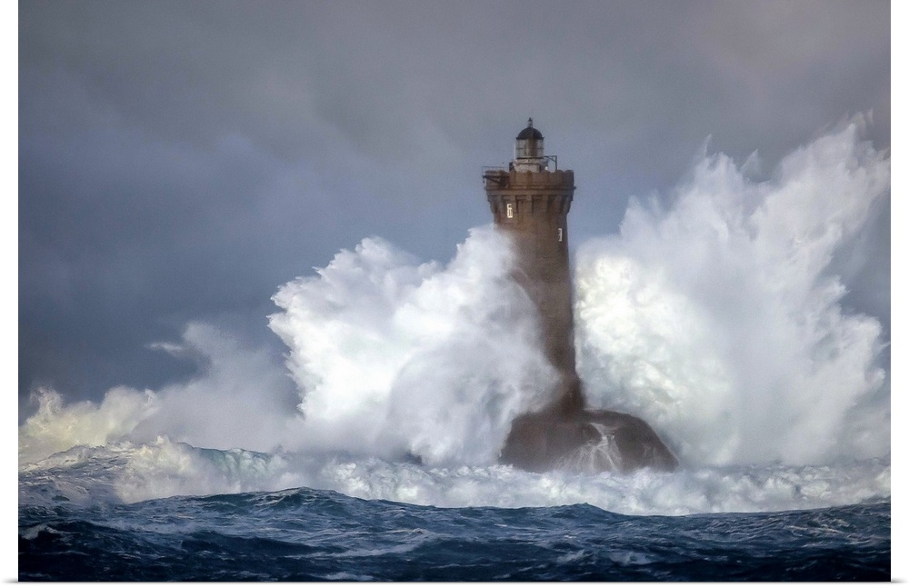 Large wave crashing onto a lighthouse in France.