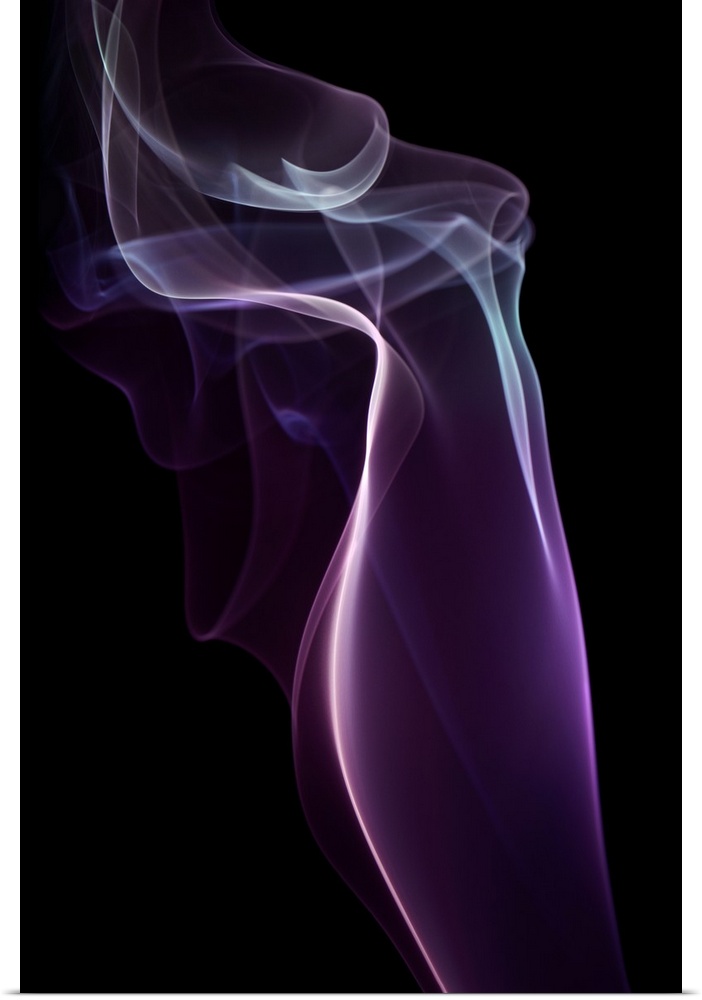 A photograph of colorful sinuous smoke against a black background.