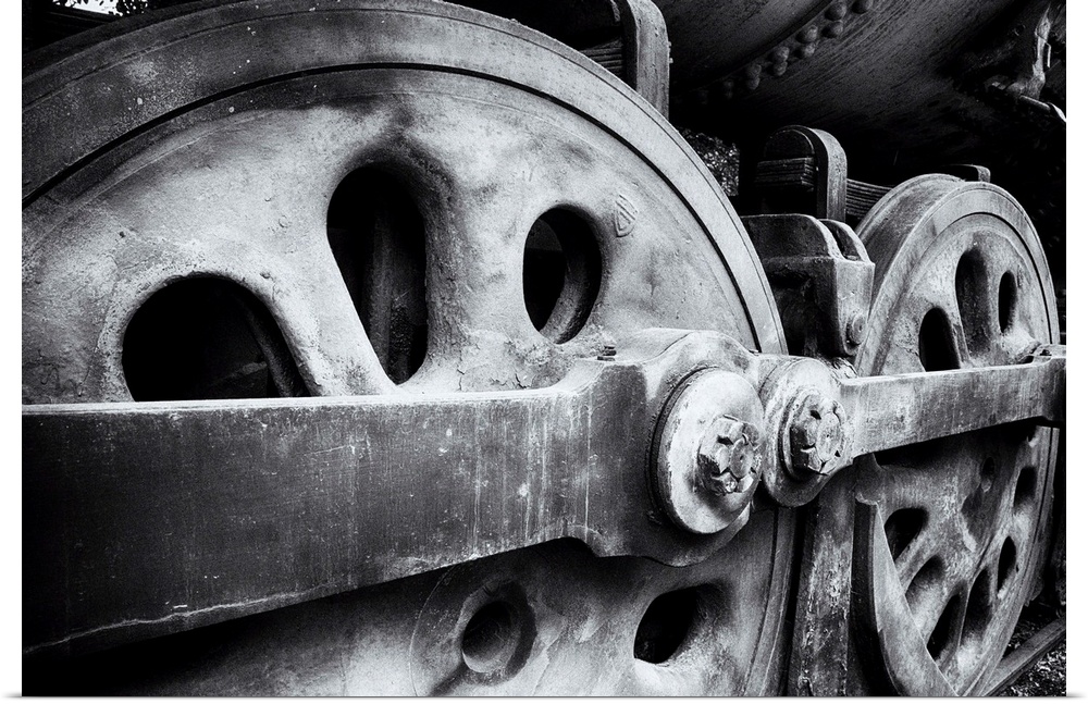 Close Up View of Wheels of a Steel Locomotive.