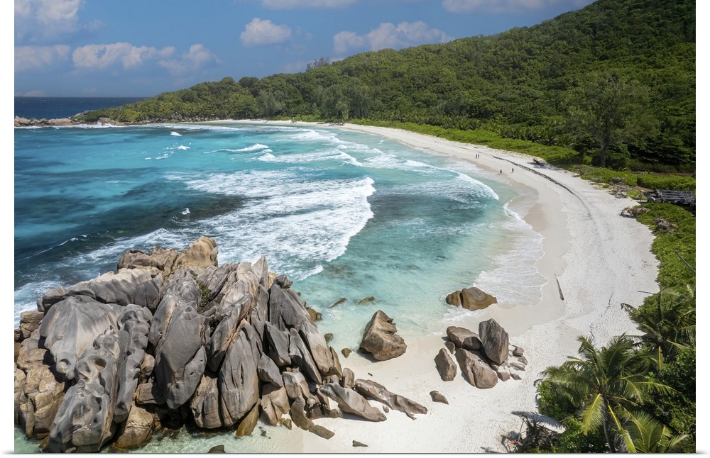 Dreamy white sandy beach with natural pools and crystal clear waters make Anse Cocos a spectacular marine cove on La Digue.
