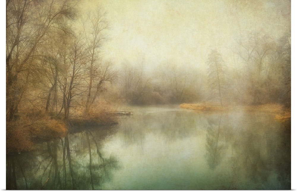 Antique style photograph of winter trees lining a calm body of water.