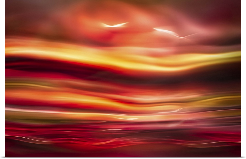 An abstract photograph of vibrant colors in a wave-like formation.