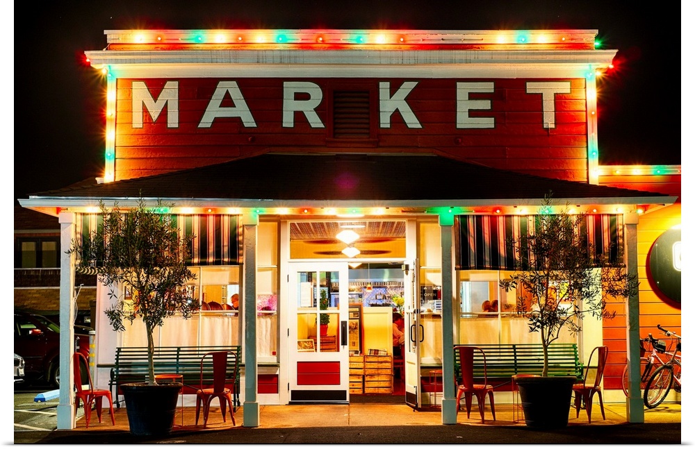 Fine art photo of a market building in Napa Valley lit up at night.