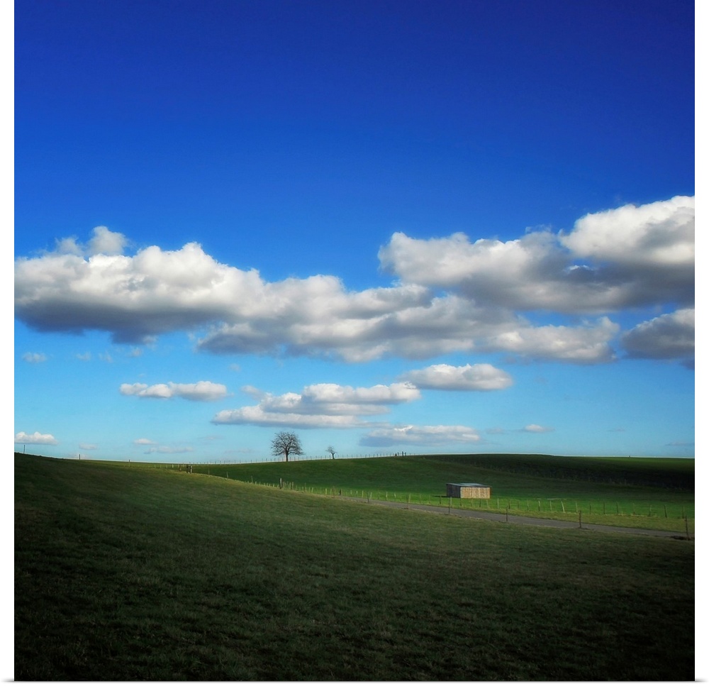 Countryside landscape with blue sky and clouds