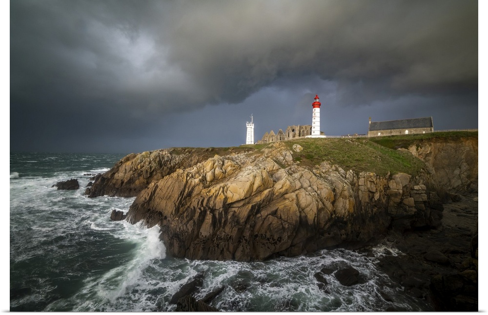 Stormy time on saint mathieu lighthouse in Brittany in France. Some grey heavy clouds coming on the place.